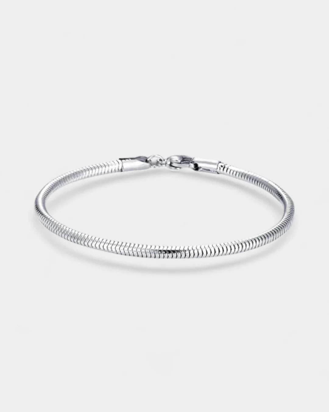 Silver bracelet on a light gray background