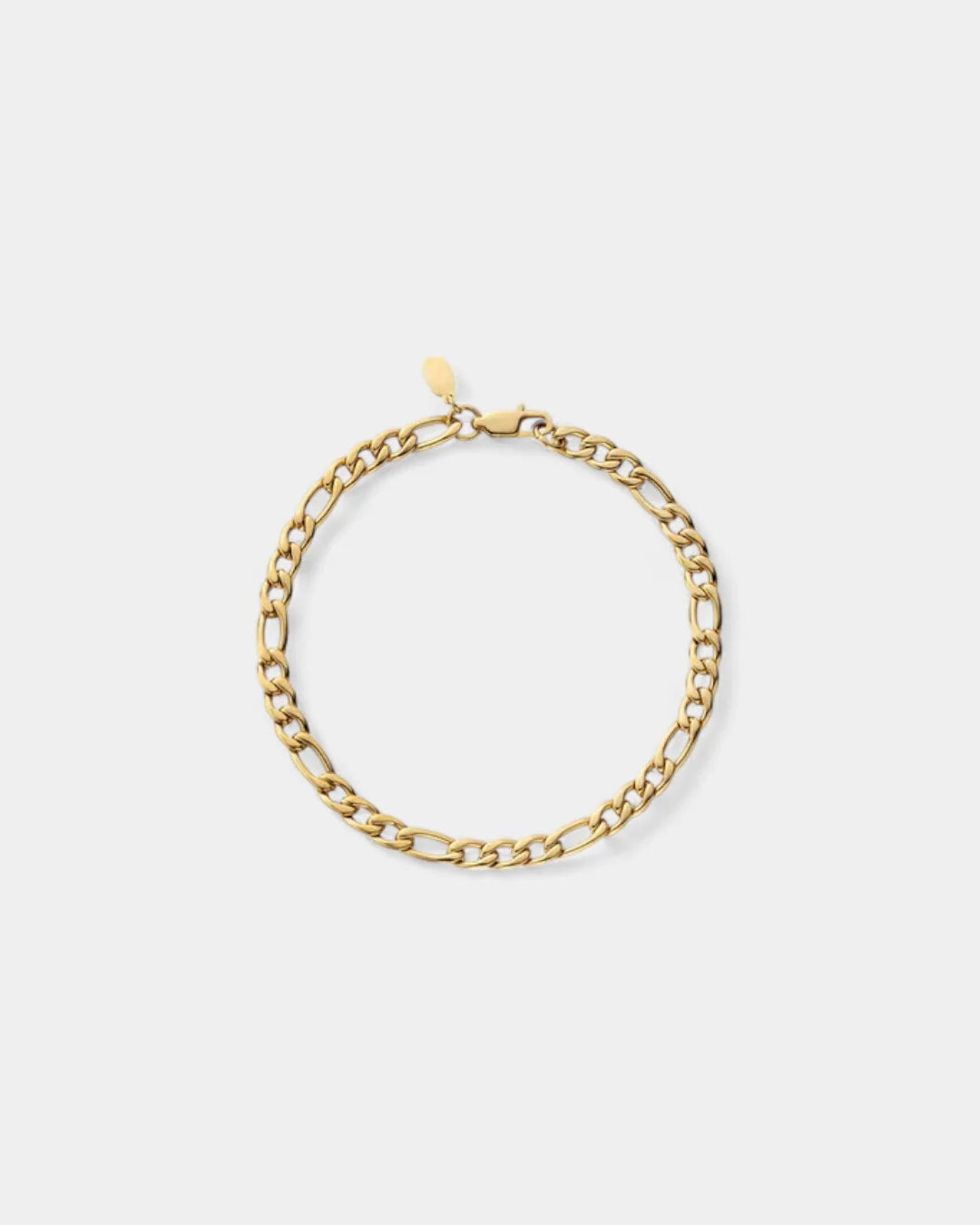 Gold chain bracelet on a light beige background