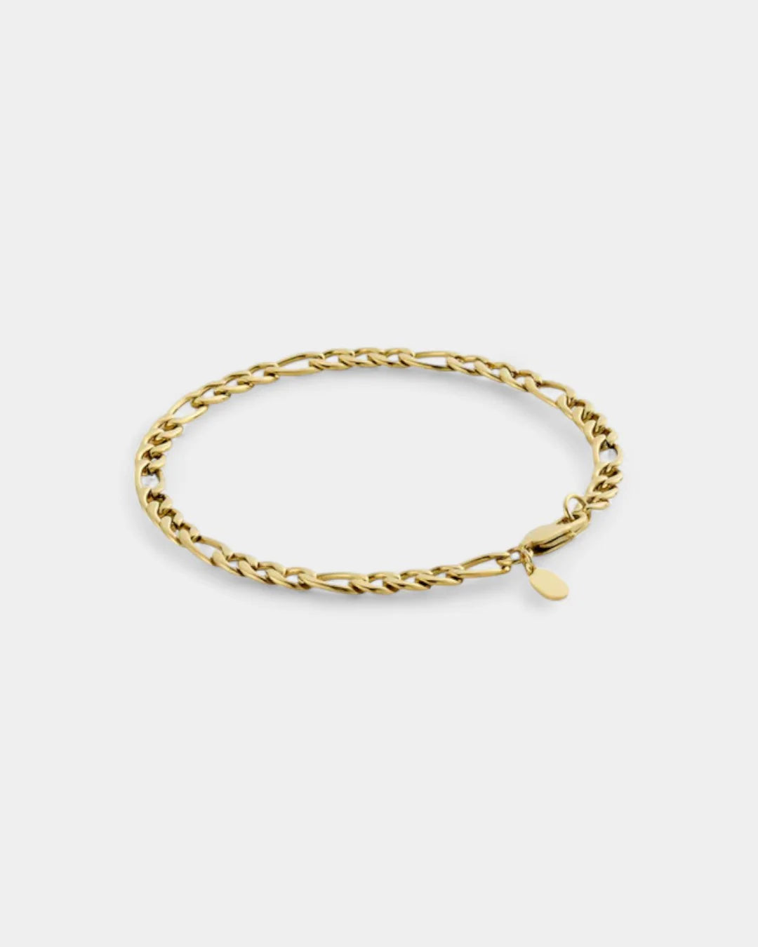 Gold chain bracelet on a light gray background